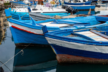 Fototapeta na wymiar Traditional italian Wooden fishing boats on the old port in Palermo, Sicily