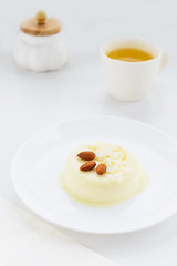 Panna cotta with almonds and a cup of green tea