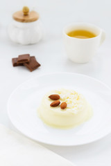 Panna cotta with almonds and a cup of green tea