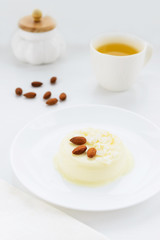 Panna cotta with almonds and a cup of green tea
