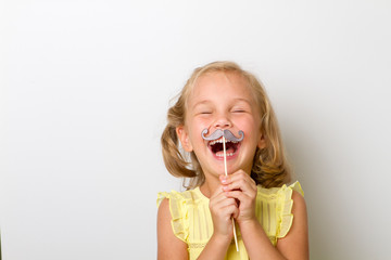 Free time for fun. Close up portrait small girl with fake mustache with plump