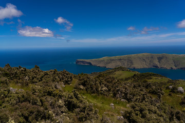 Fototapeta na wymiar Coastline in Akaroa New Zealand, Amazing view from the lookout of akaroa, above the beautiful mountains of akaroa New Zealand