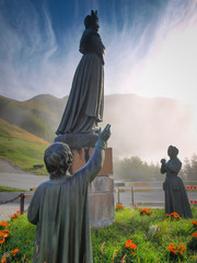 Statue depicting Our Lady of La Salette in a sanctuary in the Alps