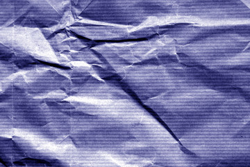 Crumpled sheet of paper in blue color.