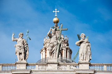 Vatican City, March 21, 2018: Statue of Jesus on the top of Saint Peter Basilica facade