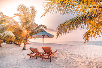 Romantic beach landscape. Couple chairs umbrella sunset sunrise colorful sky clouds. Dream beach honeymoon vacation. Best love destination travels. Amazing leisure relax wellbeing - obrazy, fototapety, plakaty