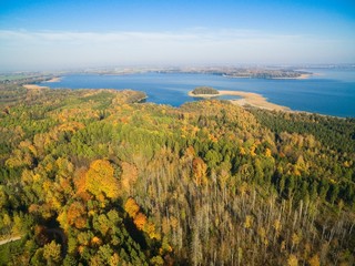 Aerial view of beautiful landscape of Mazury region during autumn season, Mamry Lake in the background, Poland