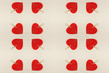 Abstract background of red hearts on light background mirror symmetry effect.