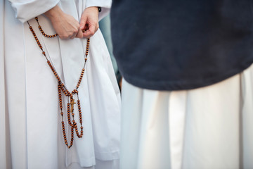 Vatican City, October 14, 2018 : A nun prays the rosary before the beginning of the celebration...