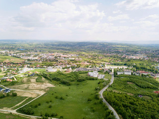 Fototapeta na wymiar Panorama of the mestain near the town of Jaslo in Poland from a bird's eye view. Aerial photography of landscapes and settlements. Urbanization of the country. Living environment of people
