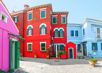 Colorful houses on the street in Burano island, near Venice. Tourism and vacation in Italy concept