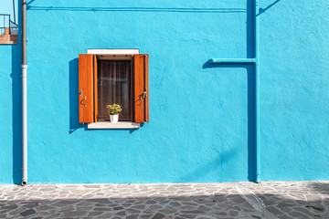 Picturesque window in blue colorful house as design concept - Powered by Adobe