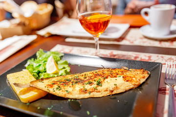 Fresh fish on a plate in restaurant