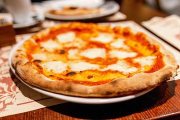 pizza on a plate in restaurant