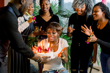 African American Friends celebrating a birthday together at the nightclub