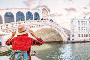 Happy asian woman admiring great view of the famous bridge over Grand Canal in Venice, vacation and...