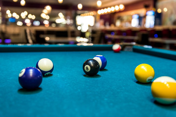Colorful billiard balls on table, game and gambling