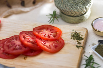 tomato slides on wooden board