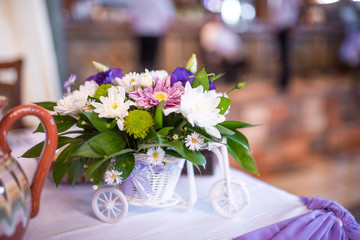 Purple and white wedding decoration with fresh flowers