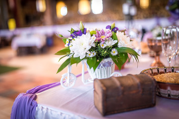 Purple and white wedding decoration with fresh flowers