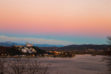 View of the Angera fortress at sunset