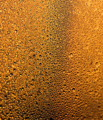 water drops on the glass surface at sunset, macro