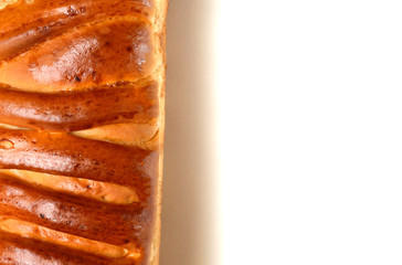 Closeup of Easter sweet bread, greek tsoureki isolated on white background. Top view. Natural lighting