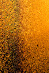water drops on the glass surface at sunset, macro