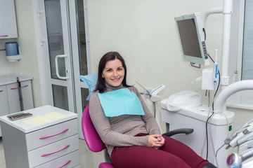 Woman sitting in dentistry waiting for doctor