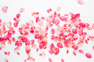 Obraz na płótnie Canvas Valentine's Day. Rose flowers petals on white background. Valentines day background. Flat lay, top view, copy space.