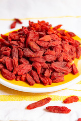 Healthy superfood, red dried goji chinese wolfberry berries, used in many snack foods and supplements, granola bars, yogurt, tea blends, fruit juice as whole berries or ground seeds, seed oil.