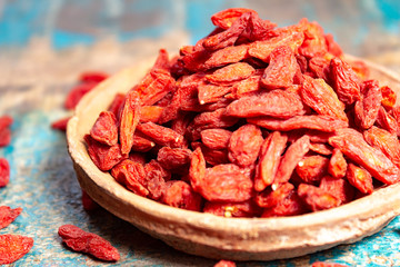 Healthy superfood, red dried goji chinese wolfberry berries, used in many snack foods and supplements, granola bars, yogurt, tea blends, fruit juice as whole berries or ground seeds, seed oil.