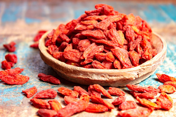 Healthy superfood, red dried goji chinese wolfberry berries, used in many snack foods and supplements, granola bars, yogurt, tea blends, fruit juice as whole berries or ground seeds, seed oil.