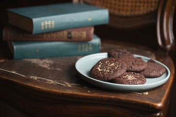 Chocolate cookies on the plate. Dark and Moody, Mystic Light food photo
