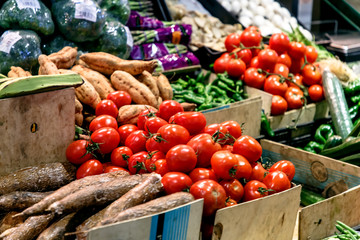Tomatoes and other vegetables are sold on the market