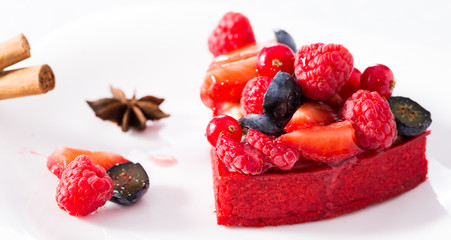 cake with fresh forest berries with cinnamon and anise