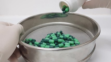 Green capsules compounding in the pharmacy laboratory