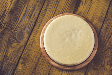 Traditional cheesecake on the wooden table