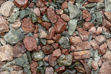 Gravel with oil stains closeup from the railway track.