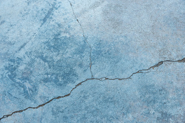 Cracked concrete texture closeup for background.