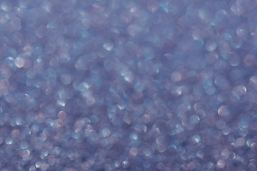 Abstrast blurred glittery shiny background, lilac, defocused