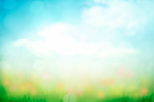 abstract nature spring background with green grass and blue sky gradient