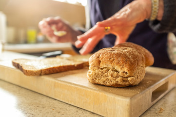 Woman making egg and onion sandwiches