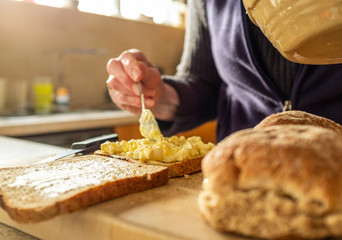 Woman making egg and onion sandwiches