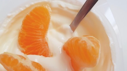 Tangerine segments in a yogurt