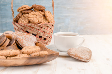 Biscuits and cup of tea on table in the morning