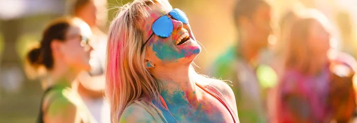 Rolgordijnen Colored girl laughs at the Holi festival © Angelov