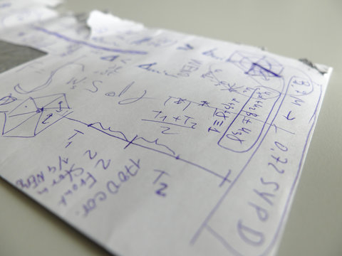 Closeup of calculations on the back of the envelope