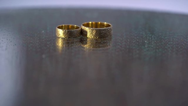 Golden rings for wedding at winter in snowly day