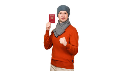 The Caucasian man with the international passport of the Russian Federation in warm clothes. A hand in a fist